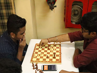 Student Playing Chess