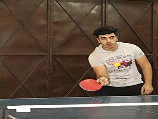 Student Playing Table Tennis